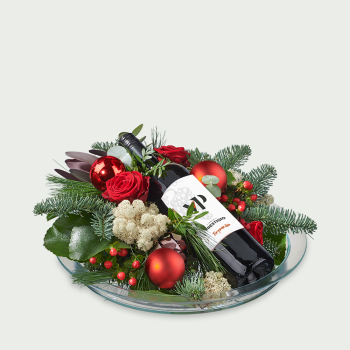 Flower arrangement Christmas red with red wine